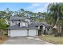 Charming two-story home with a three car garage and well-maintained landscaped yard at 293 Saxony Ct, Winter Springs, FL 32708
