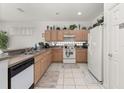 Functional kitchen with ample cabinet space and white appliances at 2983 Sunset Vista Blvd, Kissimmee, FL 34747
