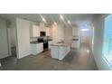 Modern kitchen boasts sleek countertops, stainless steel appliances, and an island at 3455 Fort Mellon Dr, Sanford, FL 32773