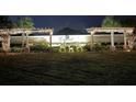 Night shot of the Esprit community sign adorned with holiday lights and deer decorations at 3610 Charmed Ln, St Cloud, FL 34772