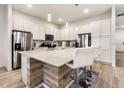 Modern kitchen with stainless steel appliances and a large island at 5414 Oakgrain Ct, Davenport, FL 33837