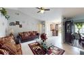 Spacious living room with a comfortable couch and decorative accents at 6855 Galle Ct, Orlando, FL 32818