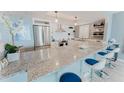 Bright, updated kitchen with stainless steel appliances, large quartz island and modern decor at 111 S Atlantic Ave # 301, Ormond Beach, FL 32176