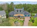 Inviting two-story home with copper porch roof and a beautiful landscaped front yard at 2438 River Rise Ct, Orlando, FL 32828