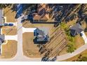 Birds eye view of a home with a long driveway and surrounding landscape at 325 Marion Oaks Golf Way, Ocala, FL 34473