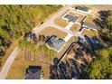 Scenic aerial view of a home nestled within a tranquil, wooded neighborhood at 325 Marion Oaks Golf Way, Ocala, FL 34473