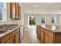 Spacious kitchen with granite countertops, stainless steel appliances, and a center island at 3773 Moon Dancer Pl, St Cloud, FL 34772