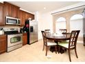 Eat-in kitchen with stainless steel appliances and wood cabinets at 4401 Messina Dr, Lake Mary, FL 32746