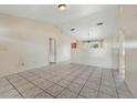 Spacious living room with tile floors and neutral walls at 6432 Delta Leah Dr, Orlando, FL 32818