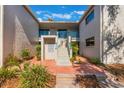 Building exterior showcasing a walkway and landscaping at 1000 Winderley Pl # 122, Maitland, FL 32751