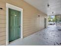 Exterior door with green paint to a unit in the condo at 13003 Plantation Park Cir # 1319, Orlando, FL 32821