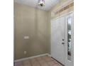 Bright entryway featuring neutral paint and tile flooring at 13713 Meadowpark Ave, Orlando, FL 32826