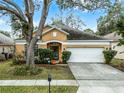 Inviting single-story home with manicured landscaping and a two-car garage at 13713 Meadowpark Ave, Orlando, FL 32826