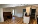 Simple kitchen with wood countertops and wood floors at 214 N New Hampshire Ave, Tavares, FL 32778