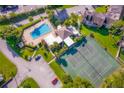 Aerial view showcasing a community pool, clubhouse, tennis court, and convenient parking at 262 Orienta Point St # 1, Altamonte Springs, FL 32701