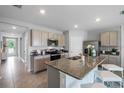 Modern kitchen with granite countertops and stainless steel appliances at 3822 Royal Azalea Way, Sanford, FL 32773