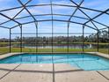 Screened pool with lake view at 4700 Golden Beach Ct, Kissimmee, FL 34746