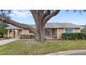 Inviting single-story home featuring a covered entrance, brick-paved drive, and lush green lawn at 4817 Gallant Ln, Orlando, FL 32821