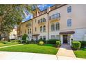 Three-story townhouses with attractive landscaping and walkway at 5409 Napoli Cv, Lake Mary, FL 32746