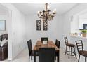 Dining room with marble table and decorative lighting, perfect for Gathering gatherings at 564 Shadow Glenn Pl, Winter Springs, FL 32708