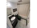 Bathroom with sleek vanity, toilet and shower with curtain at 116 Scottsdale Sq # 2, Winter Park, FL 32792