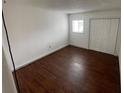 Bedroom featuring hardwood floors and ample closet space at 116 Scottsdale Sq # 2, Winter Park, FL 32792