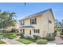 Inviting two-story townhome with well-kept landscaping and a cozy front porch at 1220 Villa Ln # 135, Apopka, FL 32712