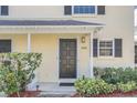 Close-up of the inviting front door, enhanced by neat landscaping at 1220 Villa Ln # 135, Apopka, FL 32712