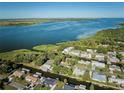 Gorgeous aerial view of waterfront homes on a large open bay at 441 Spoonbill Ct, Kenansville, FL 34739