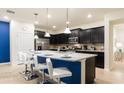 Modern kitchen with granite countertops and stainless steel appliances at 4651 Terrasonesta Dr, Davenport, FL 33837