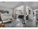 Bright and airy living room with modern decor and archway to dining room at 4941 Casa Vista Dr, Orlando, FL 32837