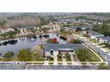 Aerial view showcasing the townhouse community with a central pond feature at 5409 Caramella Dr, Orlando, FL 32829