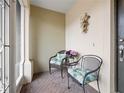 Charming patio with brick flooring, decorative chairs, and neutral walls at 5409 Caramella Dr, Orlando, FL 32829