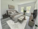 Well-lit main bedroom featuring neutral decor, luxury flooring and large windows for natural light at 15657 Sw 37Th Cir, Ocala, FL 34473