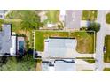A stunning aerial view showing the layout of the home and showcasing the expansive backyard at 2243 Davis Dr, New Smyrna Beach, FL 32168