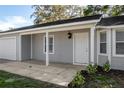 Close-up of a covered front porch and entry door to an inviting single-Gathering home at 6356 Sleepy Hollow Dr, Orlando, FL 32810
