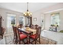 Traditional dining room featuring a wooden table and ample natural light at 2606 Pinyonpine Ln, Sanford, FL 32773