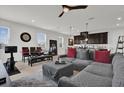 Open living area with natural light, featuring tiled floors, kitchen and dining space at 2788 Pleasant Cypress Cir, Kissimmee, FL 34741