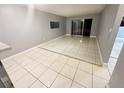 Spacious living room featuring tile flooring and sliding glass doors at 801 W Lancaster Rd # 92, Orlando, FL 32809