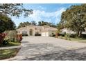 Charming single-story home featuring a spacious driveway, manicured landscaping and a 3-car garage at 126 Seville Chase Dr, Winter Springs, FL 32708