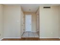 Bright entryway with tiled flooring and fresh white doors at 133 Springwood Cir # A, Longwood, FL 32750