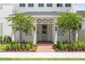 Charming home featuring a beautifully landscaped front yard and inviting front entrance at 3011 Amherst Ave, Orlando, FL 32804