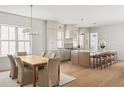 Spacious kitchen with an open dining area and a large center island with seating at 3011 Amherst Ave, Orlando, FL 32804