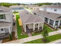 Aerial view of a single story home with well manicured lawn and landscaping, surrounded by similar homes in a planned community at 652 Kimber Ln, Debary, FL 32713