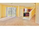 Bright and airy living room with sliding glass doors to the backyard at 1183 Chervil Dr, Poinciana, FL 34759