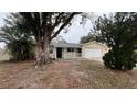 Charming single-story home with a well-manicured lawn and a welcoming front porch at 1201 S Oxalis Ave, Orlando, FL 32807