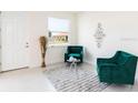 Stylish living space with comfy seating and a bright window at 1766 Coriander Dr, Kissimmee, FL 34759