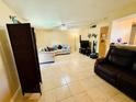 Bright living room with tile flooring, ceiling fan, and comfortable seating area at 282 Scottsdale Sq # 282, Winter Park, FL 32792