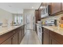 Modern kitchen with stainless steel appliances, backsplash, and granite countertops at 486 Windmill Palm Cir, Altamonte Springs, FL 32701