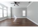 Inviting bedroom with hardwood floors and plenty of natural light at 6825 Dolce St, Orlando, FL 32819